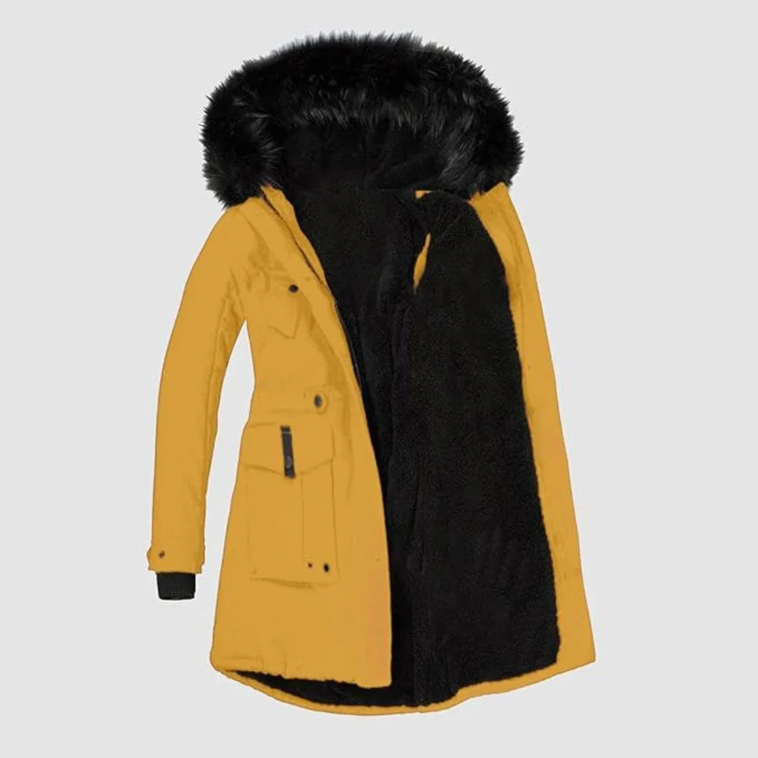Mustard yellow parka with a plush black faux-fur hood lining, drawstring waist, and buttoned patch pockets.