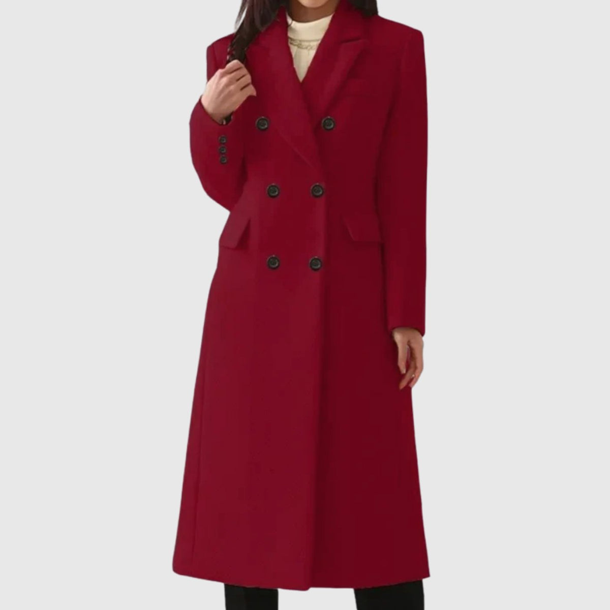 Full-length front view of a woman wearing a burgundy red double-breasted longline coat with dark front buttons.