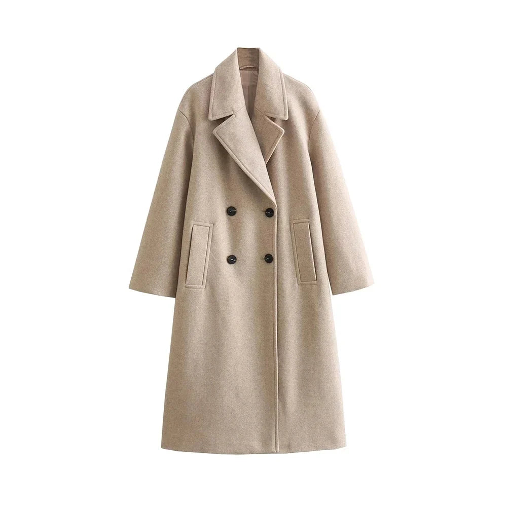 Front view of a beige women's oversized longline wool coat featuring wide notch lapels, a double-breasted four-button front closure, dropped shoulders, and welt side pockets against a plain white background.