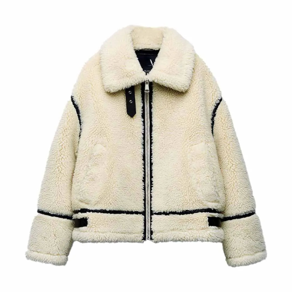 An cream-colored oversized fleece teddy jacket featuring black faux-leather contrast piping, a front zip closure, a fold-over collar, and a buckle strap at the neck, isolated against a white background.