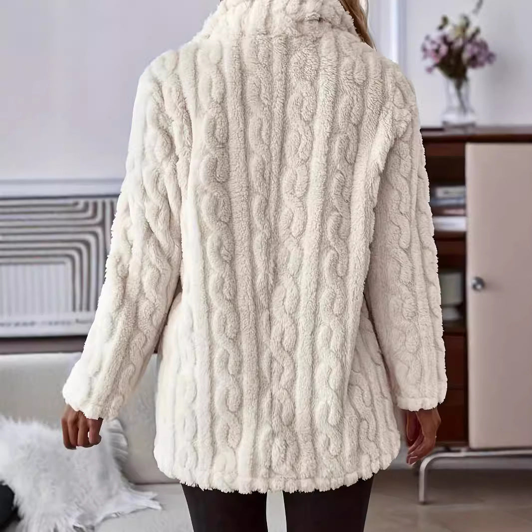 Back view of a woman wearing an off-white cable-textured teddy fleece coat with long sleeves and a plush finish.