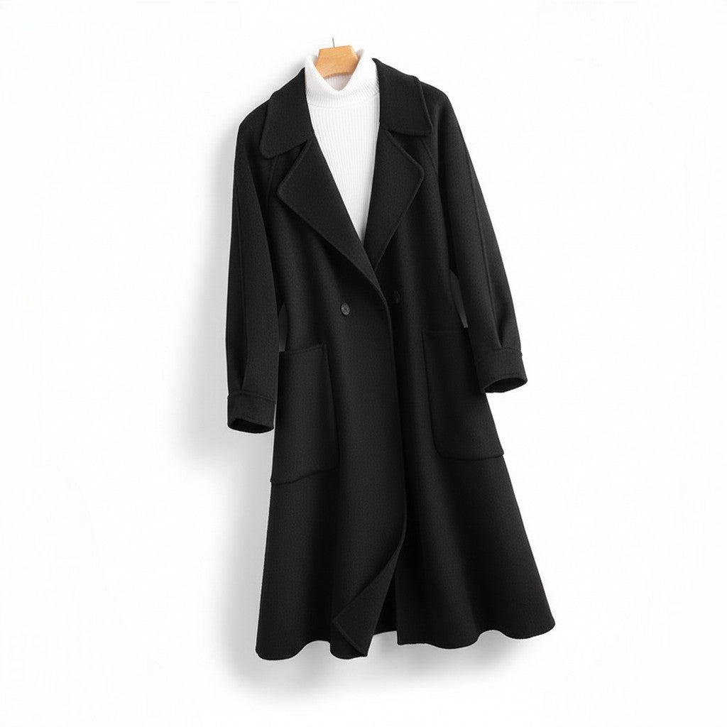 Front view of a women's black longline wool coat on a hanger with notched lapels and front patch pockets, layered over a white ribbed turtleneck.