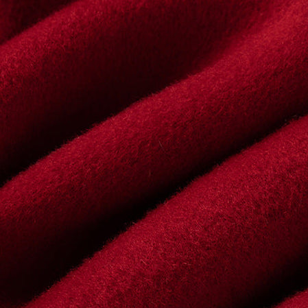 Macro close-up shot of the soft, brushed red wool-blend fabric texture.