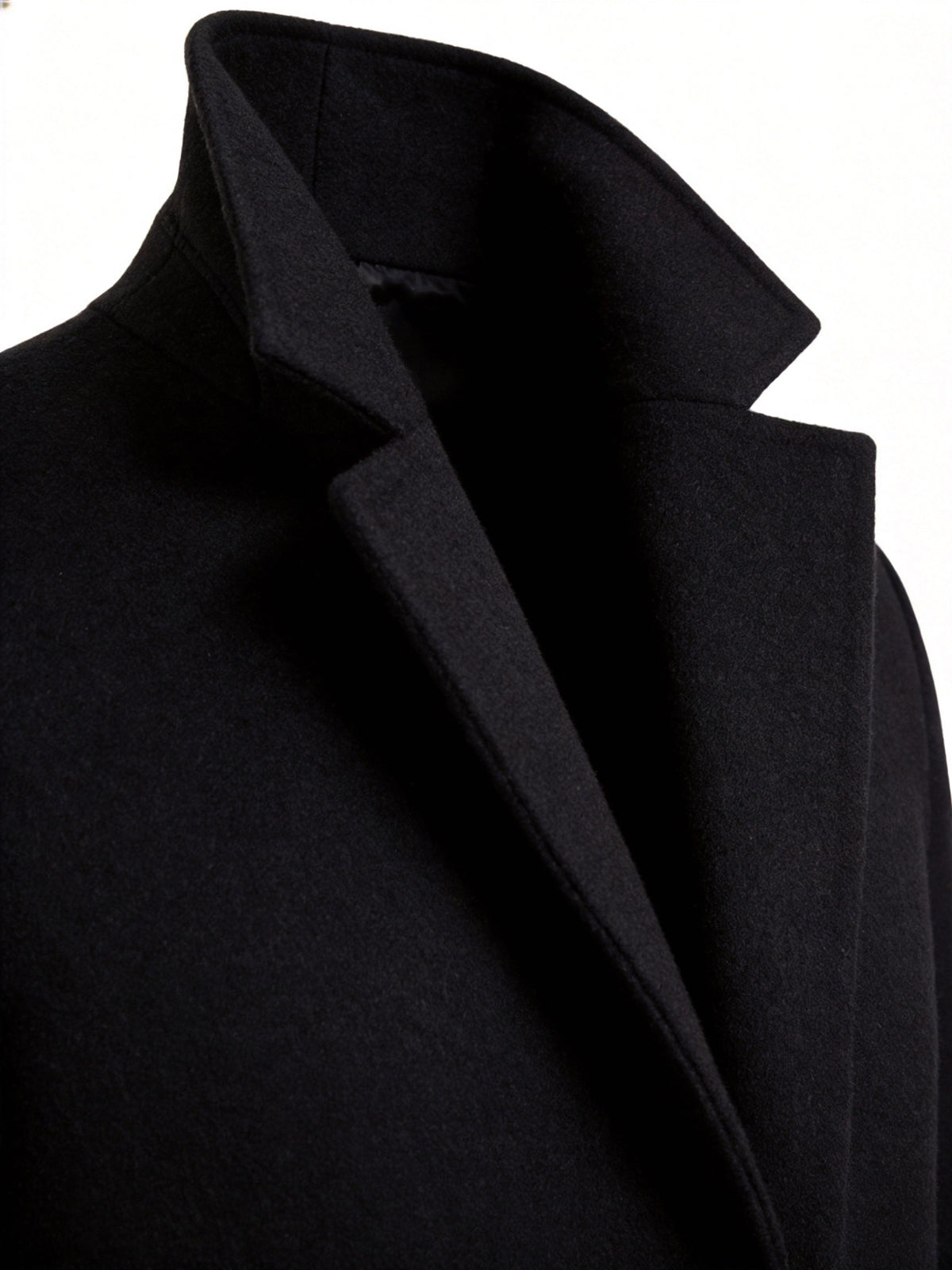 Close-up of the navy Wool-Blend Longline Trench Coat showing the notch collar and structured lapel detail.