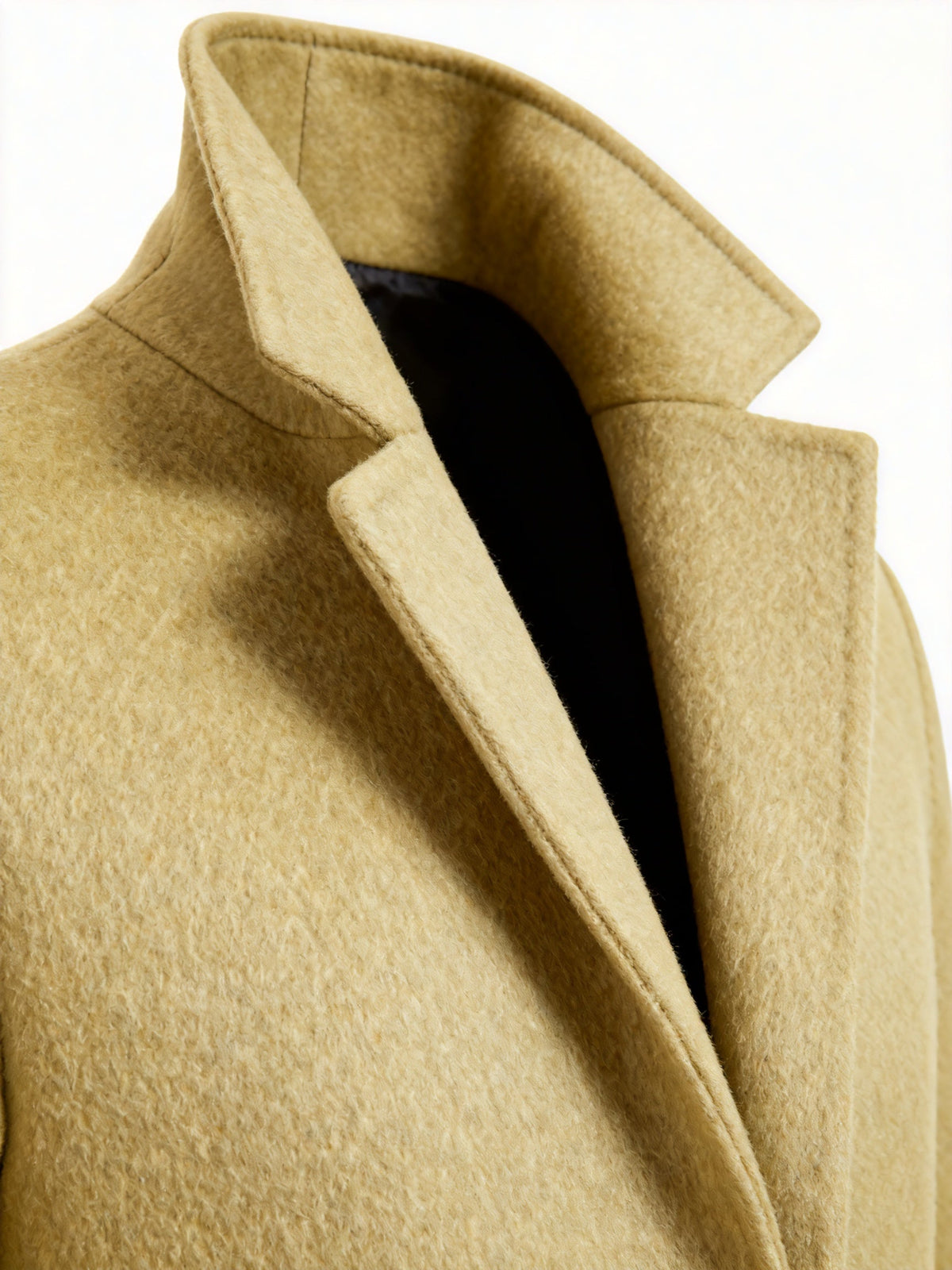 Close-up of the yellow Wool-Blend Longline Trench Coat showing the notch collar, structured lapel, and smooth wool-blend fabric.