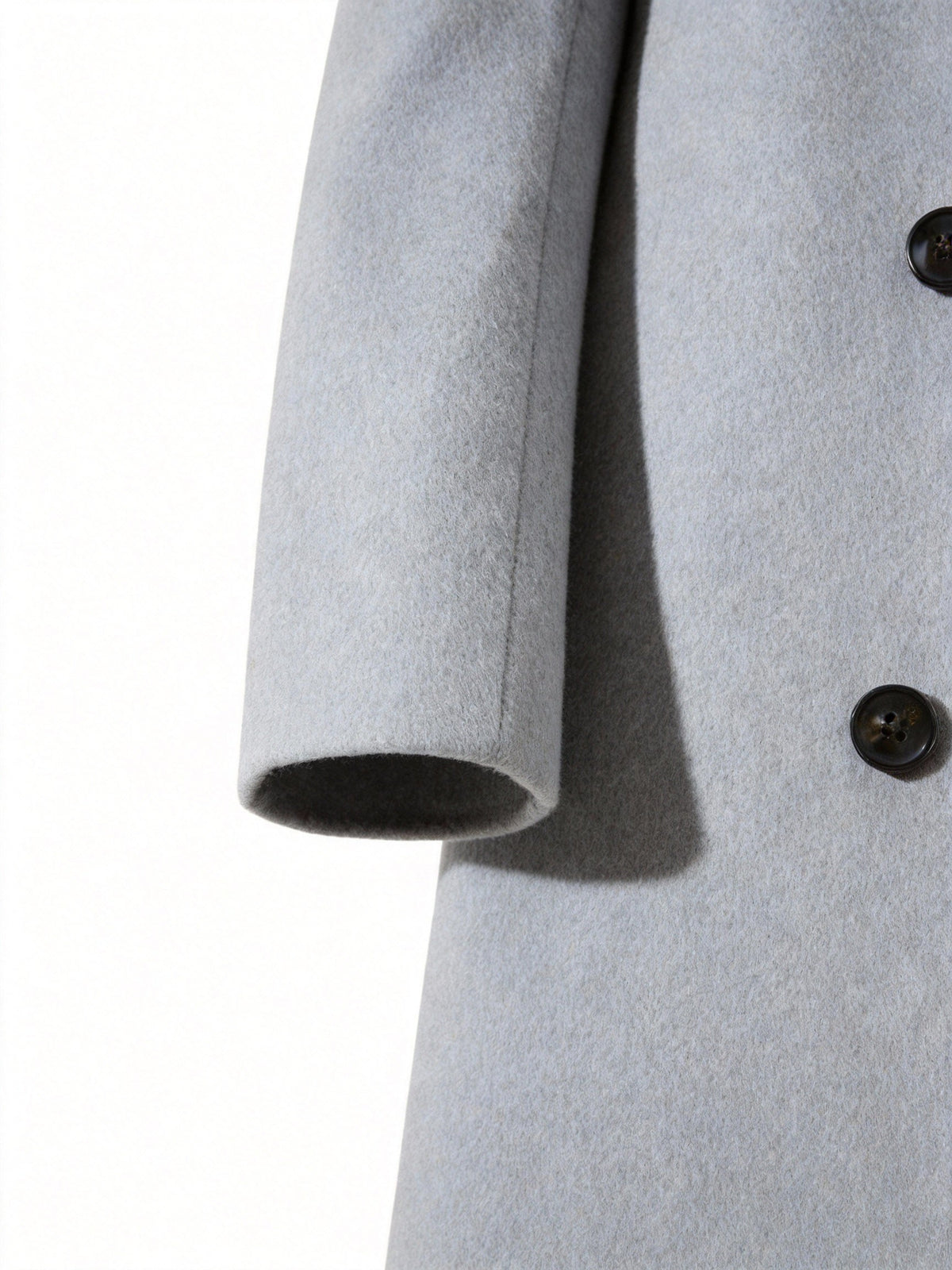 Close-up of the light gray Wool-Blend Longline Trench Coat sleeve, showing the tailored cuff and smooth wool-blend fabric.