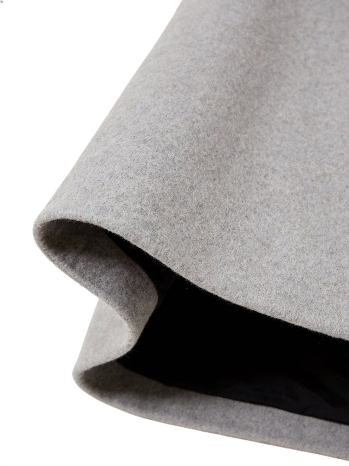 Close-up of the light gray Wool-Blend Longline Trench Coat hem, highlighting the smooth fabric and longline construction.