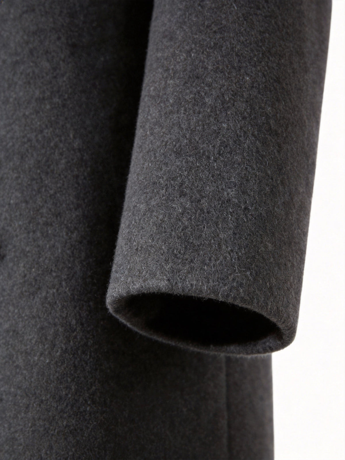 Close-up of the black Wool-Blend Longline Trench Coat sleeve, highlighting the tailored cuff and smooth wool-blend fabric.