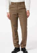 Front close-up view of a man wearing brown wool herringbone flat-front dress pants paired with a tucked-in white dress shirt and black leather dress shoes against a plain light background
