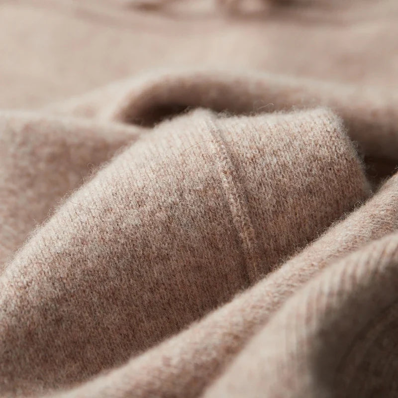 Close-up texture view showing the soft, plush knit weave of the wool fabric.