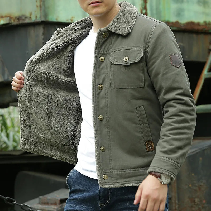 Model posing outdoors holding the jacket open to show the thick plush fleece lining and grey sherpa collar.