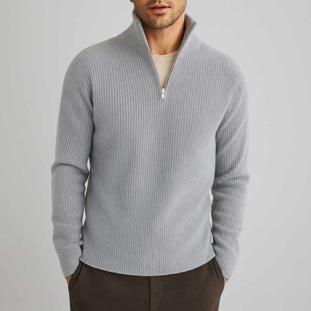 Light grey merino wool quarter-zip sweater with a structured ribbed texture and a polished zip-neck collar.