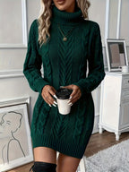 Dark green cable-knit sweater dress with a high turtleneck and ribbed trim in a structured, H-line silhouette.