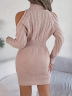 Beige cable knit turtleneck sweater dress featuring cold-shoulder cutouts and a fitted, ribbed mini silhouette.