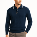 Navy blue long-sleeve polo sweater in fine-gauge vertical ribbed knit with a white contrast-trim collar and button placket.