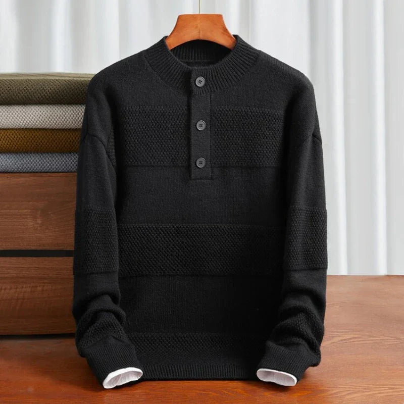 Black cotton henley sweater with textured stripe panels, three-button placket, and ribbed trim in a relaxed fit.