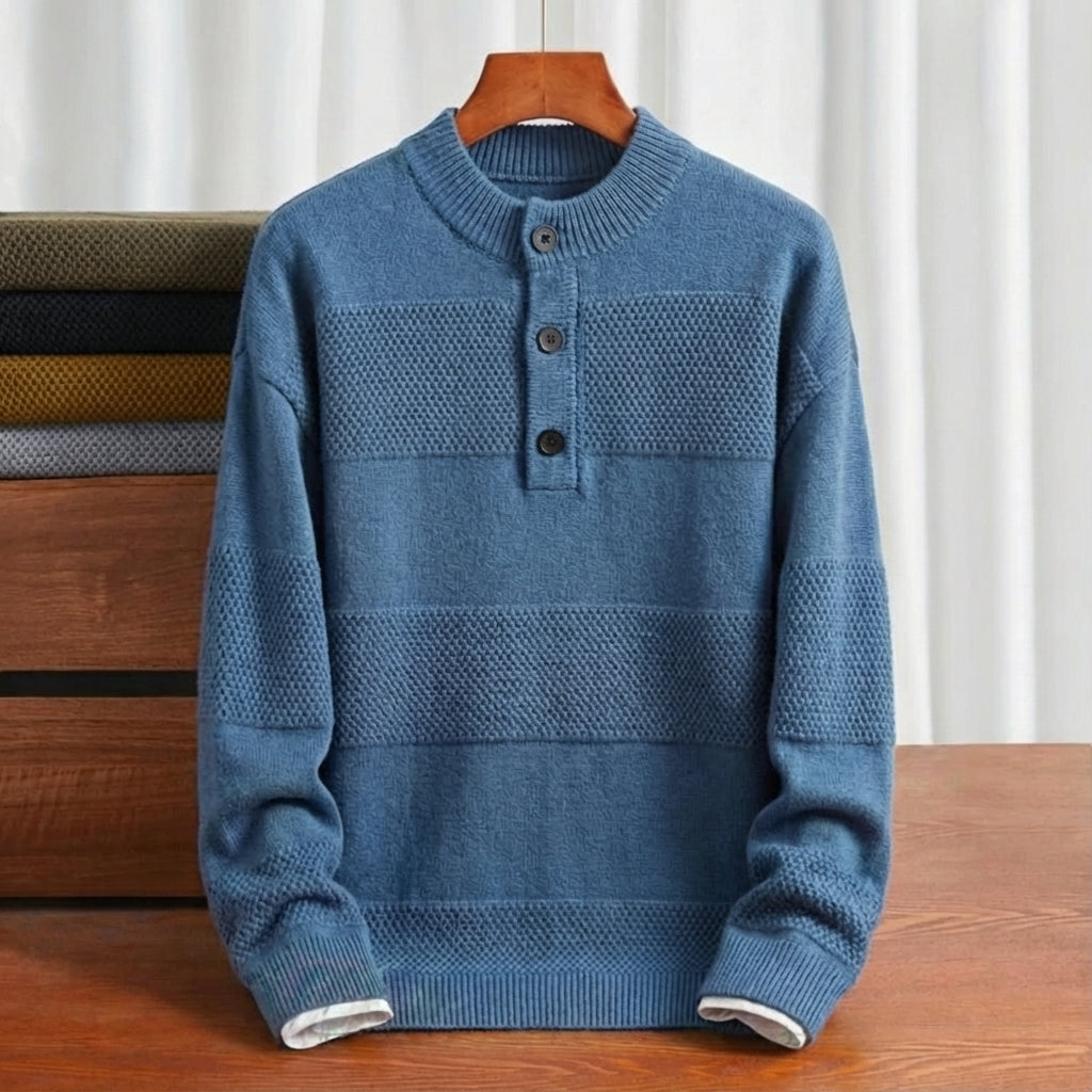 Blue cotton knit henley sweater featuring a textured stripe pattern, three-button placket, and ribbed trim on a hanger.