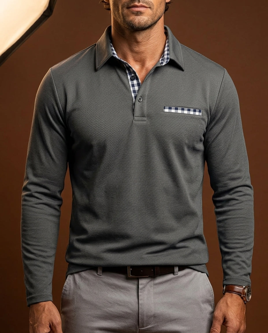 Grey long-sleeve pique polo featuring a navy gingham-trimmed placket and chest pocket on a tailored, textured fit.