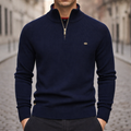 Navy ribbed knit quarter-zip sweater with a mock neck, raglan sleeves, and gold hardware in a slim fit.