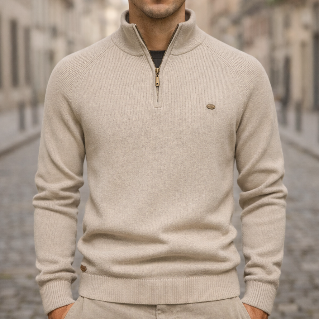 Beige ribbed knit quarter-zip sweater with a mock neck, raglan sleeves, and a slim, structured fit.