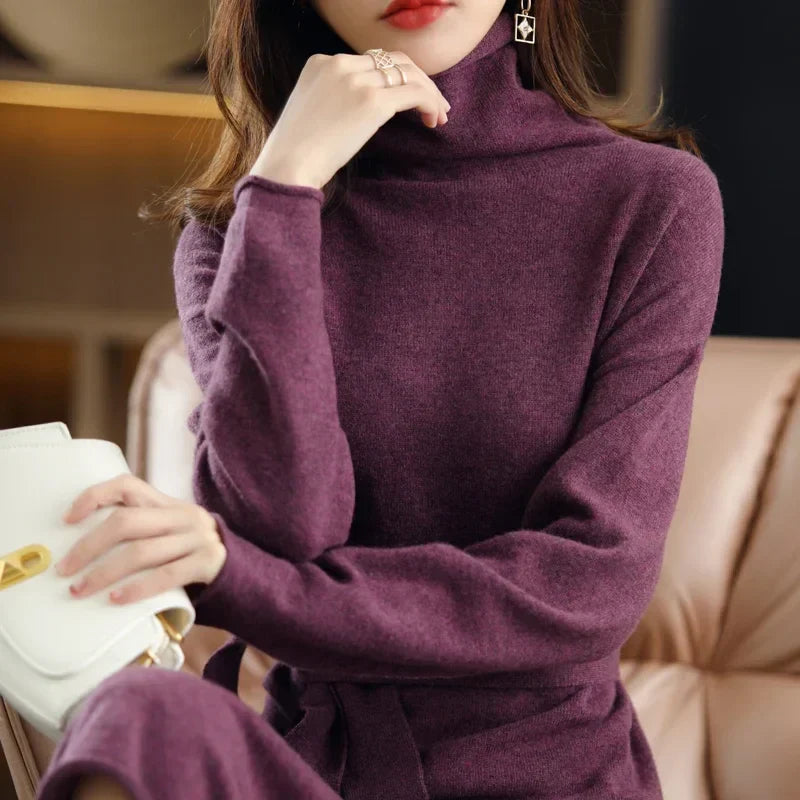 Plum purple wool midi sweater dress featuring a high-neck silhouette and a waist-defining tie belt.