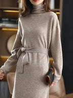 Beige wool midi sweater dress with a high neck, long sleeves, and a self-tie waist belt for a tailored silhouette.
