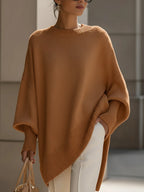 Camel oversized ribbed knit sweater with a relaxed poncho silhouette, drop shoulders, and structured cuffs.