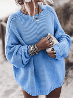 Bright blue chunky knit sweater with an oversized fit, balloon sleeves, and a ribbed crewneck.