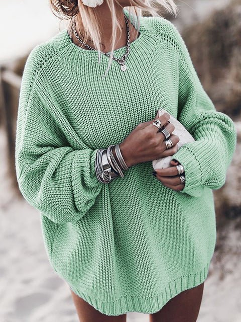 Mint green chunky knit sweater with an oversized fit, dropped shoulders, balloon sleeves, and ribbed crewneck trim.