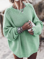Mint green chunky knit sweater with an oversized fit, dropped shoulders, balloon sleeves, and ribbed crewneck trim.