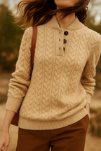 Beige wool-blend cable-knit sweater with a button-up stand collar, slim fit, and ribbed trim worn with brown trousers.