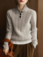 Light grey wool-blend cable-knit sweater featuring a button-up stand collar and a slim, structured fit.