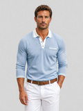 Light blue long-sleeve knit polo with a white contrast collar, button placket, chest pocket, and striped cuff trim.