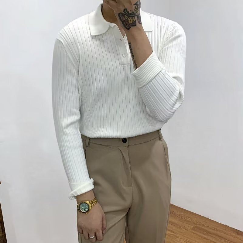 White long-sleeve polo sweater in vertical rib-knit with a lapel collar, button placket, and ribbed cuffs.