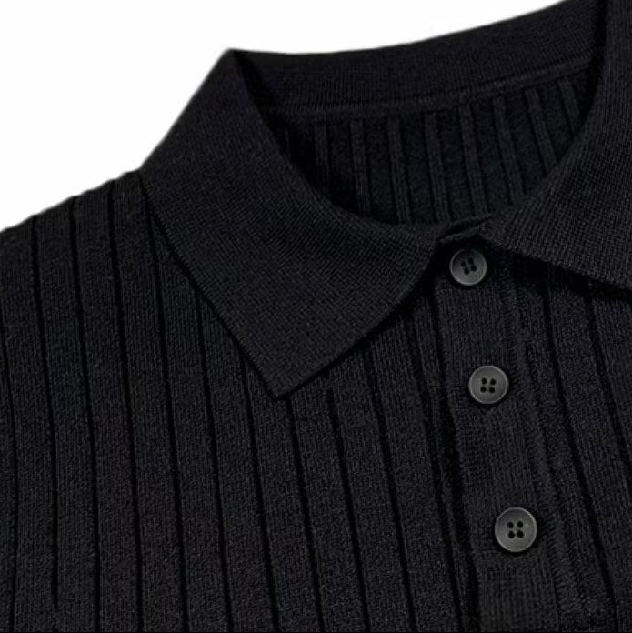 Black long-sleeve polo sweater in vertical rib-knit featuring a lapel collar and a three-button placket.