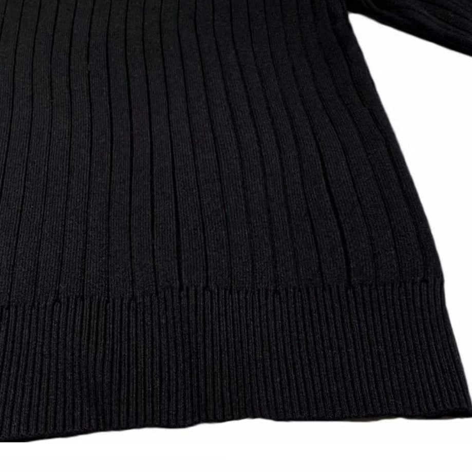 Black long-sleeve polo sweater in a vertical rib-knit texture with a finished ribbed hem.