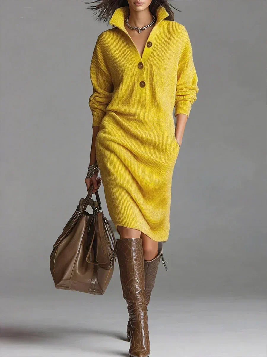 Yellow ribbed knit midi sweater dress with a button-down collar, long sleeves, and a relaxed fit worn with brown boots.