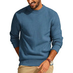 Blue waffle-knit crew neck sweater with a relaxed fit, ribbed cuffs, and hem in a textured diamond-stitch pattern.