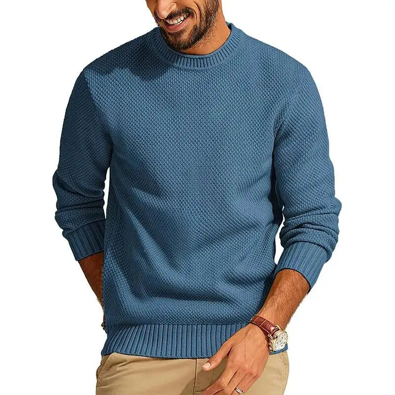 Blue waffle-knit crew neck sweater with a relaxed fit, ribbed cuffs, and hem in a textured diamond-stitch pattern.