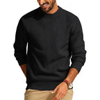 Black waffle-knit crew neck sweater with a textured diamond-stitch pattern, long sleeves, and ribbed cuffs and hem.