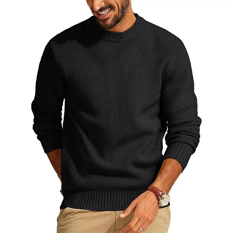 Black waffle-knit crew neck sweater with a textured diamond-stitch pattern, long sleeves, and ribbed cuffs and hem.