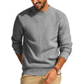 Grey waffle-knit crew neck sweater with a relaxed fit, long sleeves, and ribbed cuffs and hem.