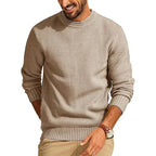 Tan waffle-knit crew neck sweater with a relaxed fit, ribbed cuffs, and hem, worn by a man in a casual setting.