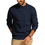 Navy blue waffle-knit crew neck sweater with ribbed cuffs and hem in a relaxed, comfortable fit.