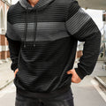 Colorblock Waffle-Knit Hoodie – Black hoodie worn by a male model with a dark gray contrast chest panel and front pocket
