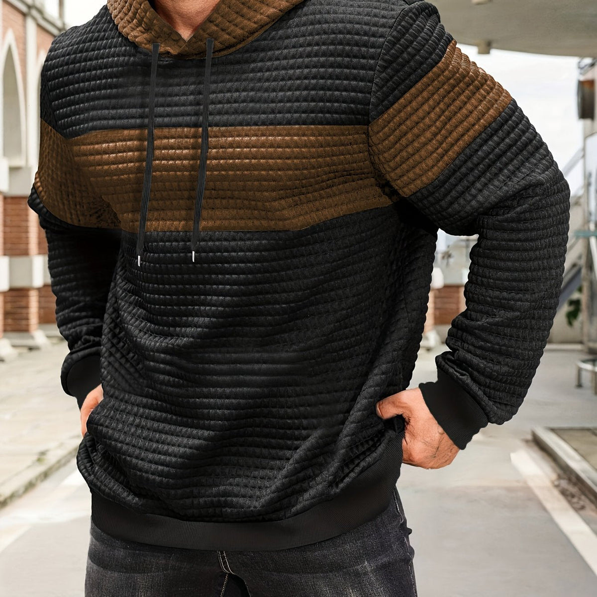 Colorblock Waffle-Knit Hoodie – Black and  brown colorblock waffle-knit hoodie worn by a male model