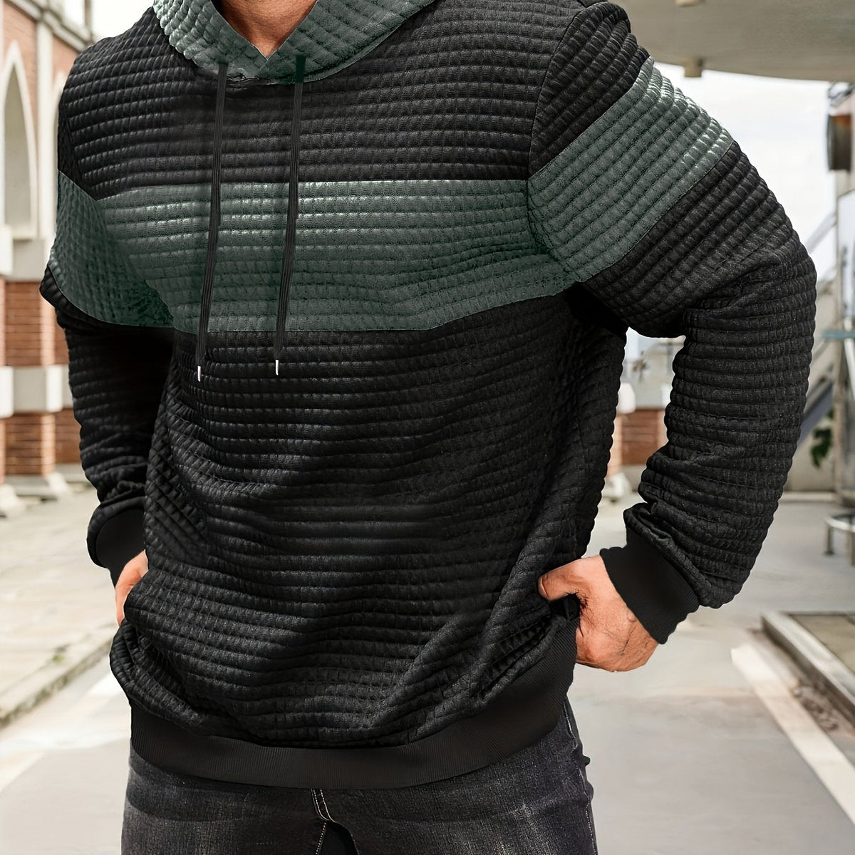 Colorblock Waffle-Knit Hoodie – Black and green colorblock waffle-knit hoodie worn by a male model