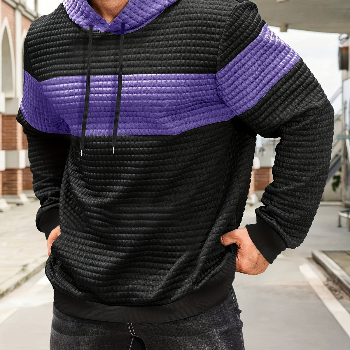 Colorblock Waffle-Knit Hoodie – Black and purple colorblock waffle-knit hoodie worn by a male model