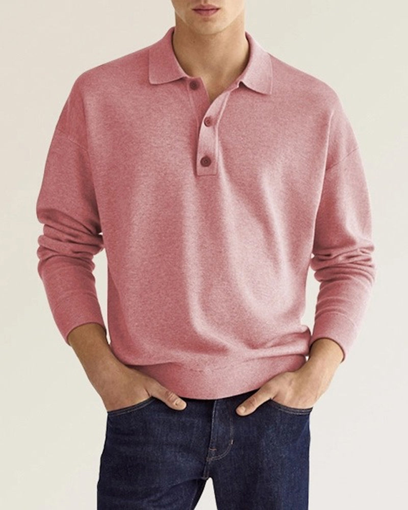Dusty pink long-sleeve knit polo with a relaxed dropped-shoulder fit, ribbed collar, and two-button placket.