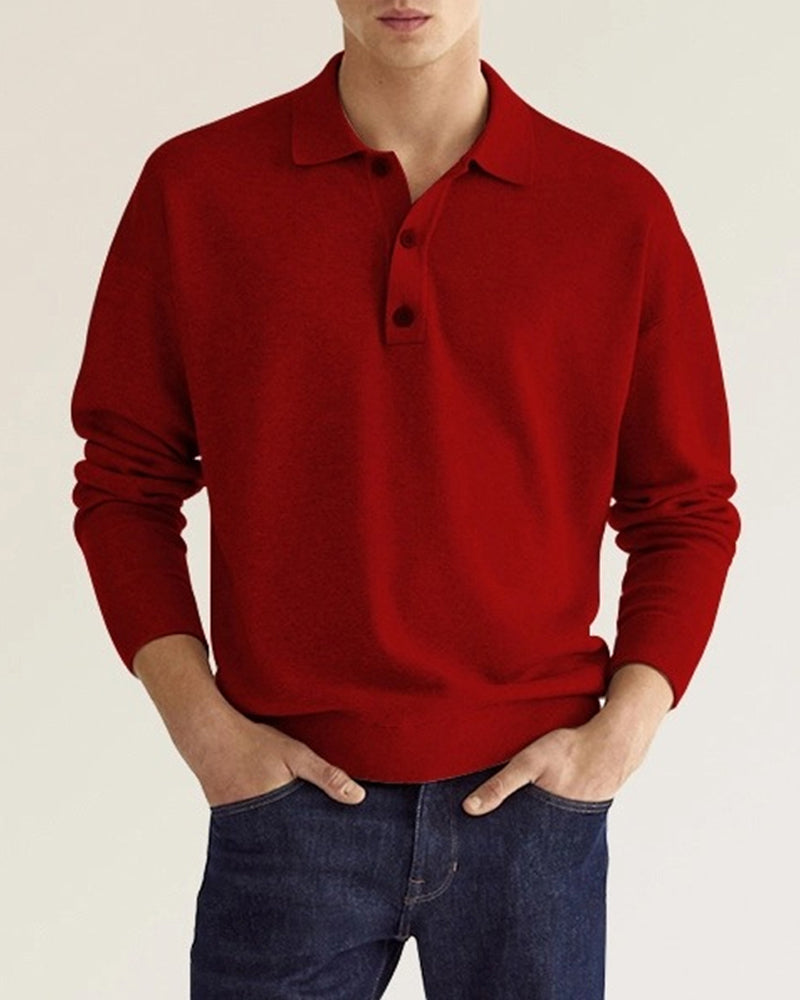 Red long-sleeve knit polo with a ribbed collar, two-button placket, and relaxed dropped-shoulder fit.